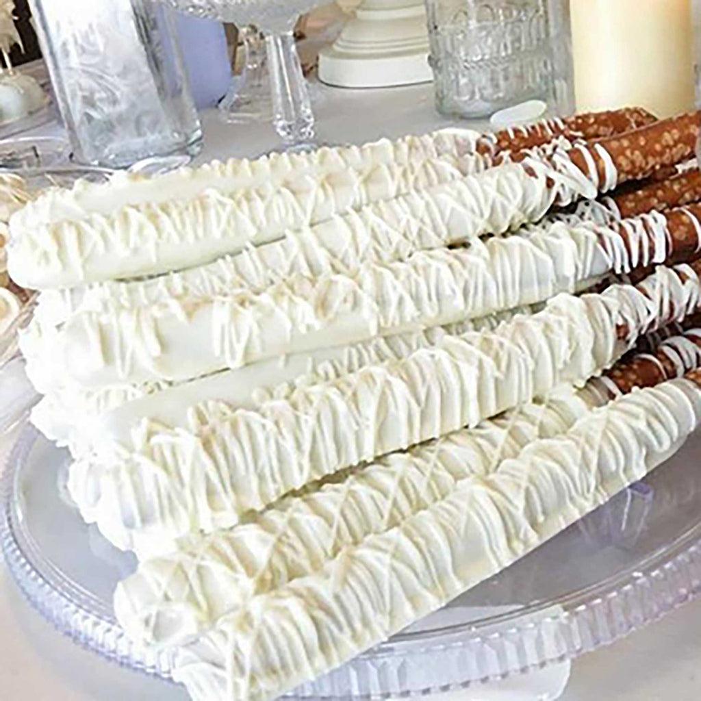 Stack of white chocolate pretzels with a blurred background.