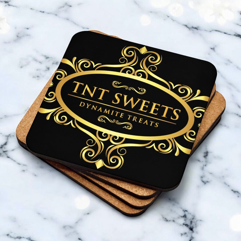 Stack of four black coasters with a gold logo on a marble background.