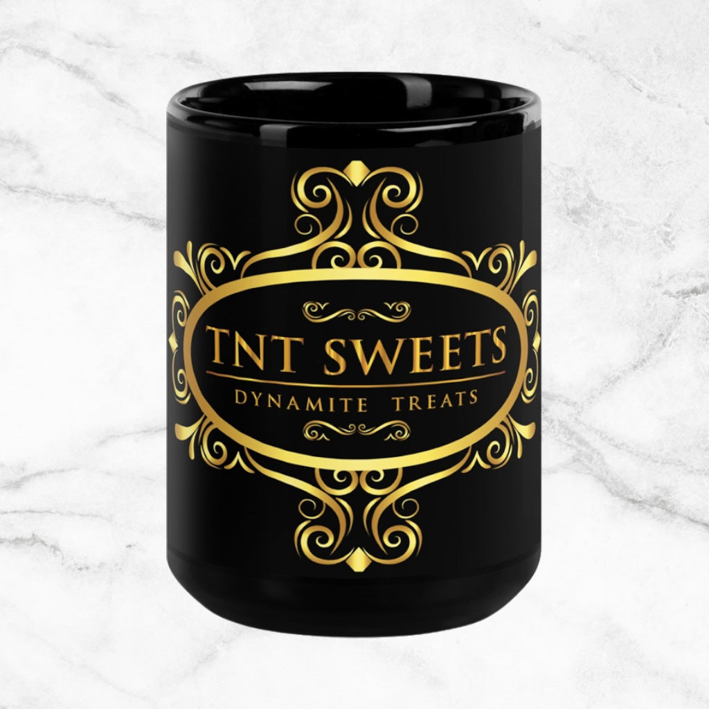Black 15oz ceramic mug with a black logo on a white marble countertop.