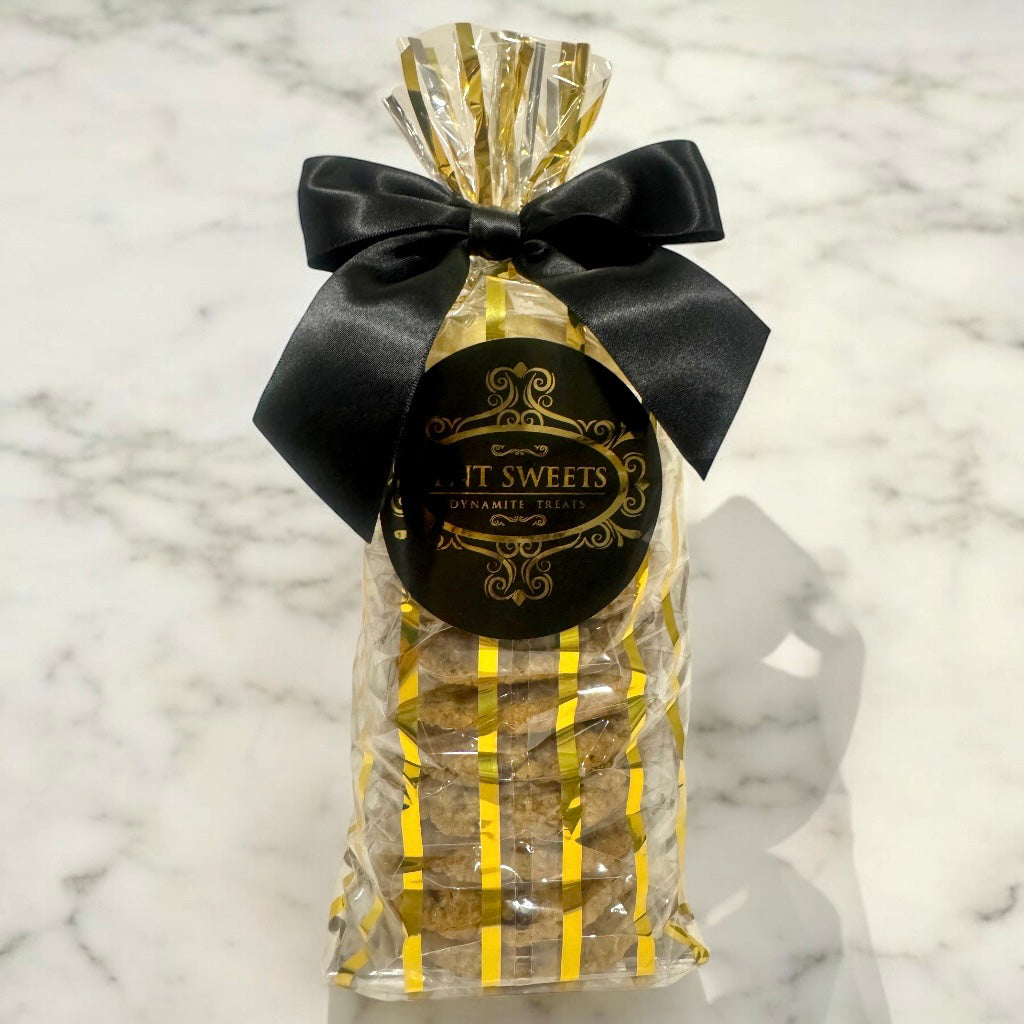 Assorted cookies in a gold striped gift bag
