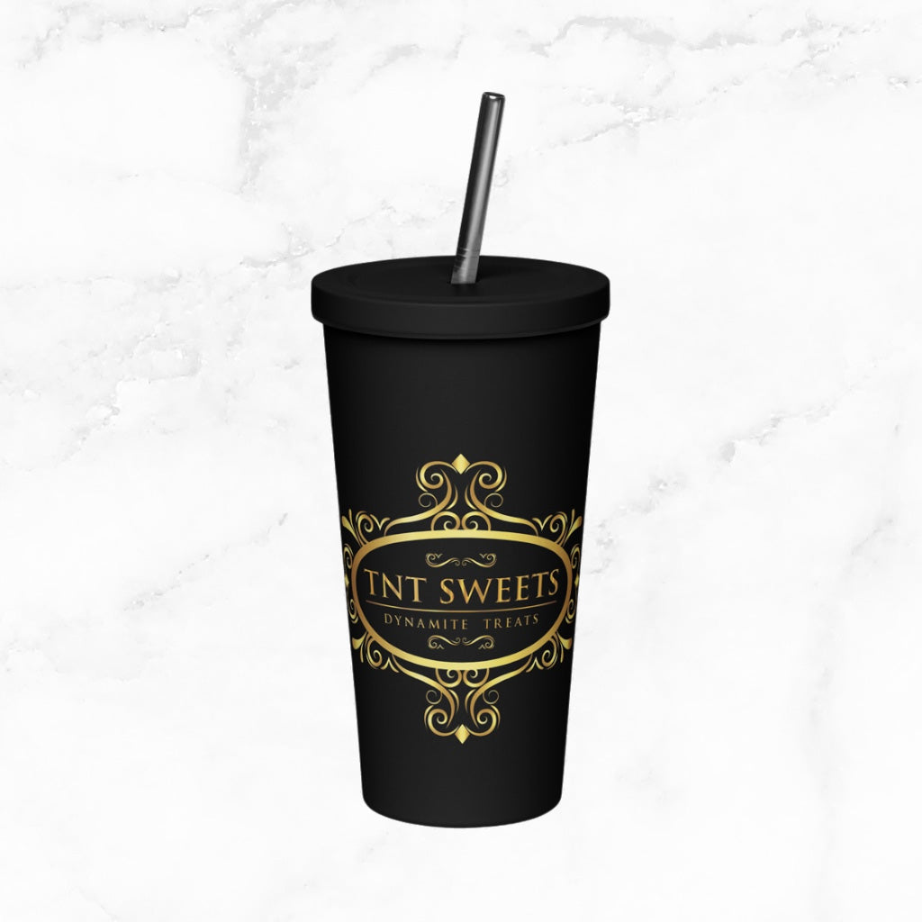 Signature black tumbler with gold logo on white marble countertop.