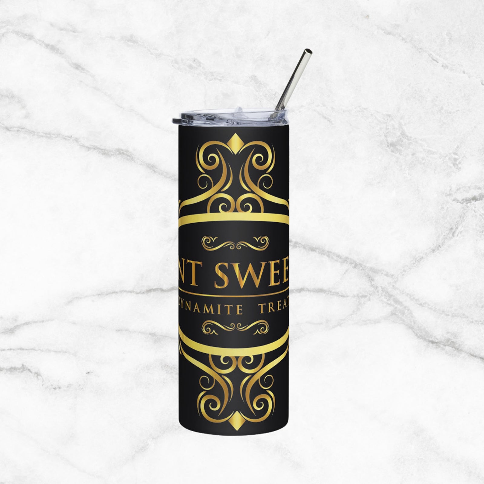 Black and gold tumbler with logo on a marble background.