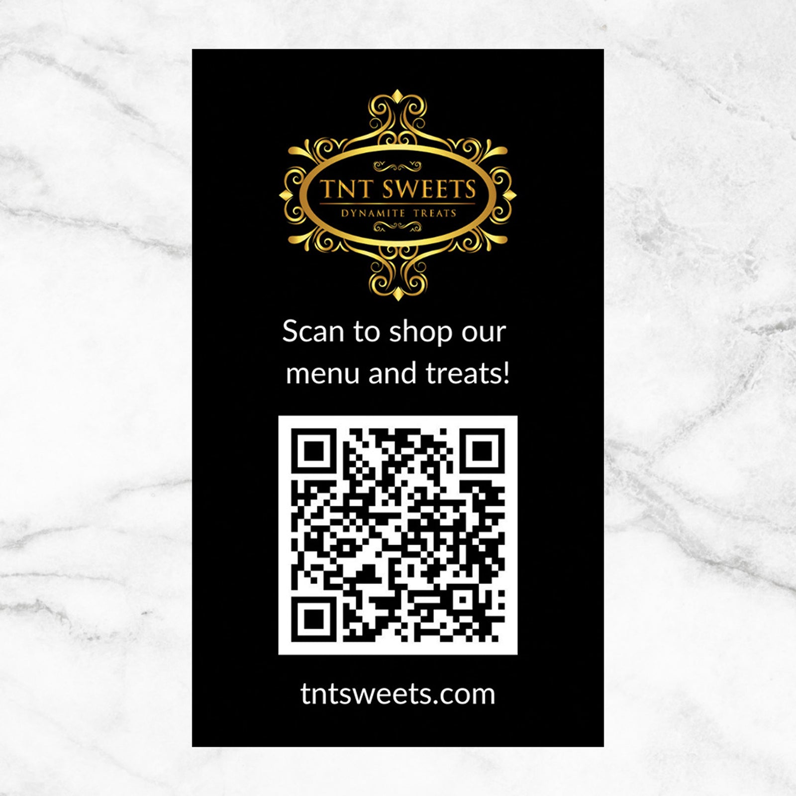 QR Code of TNT Sweets digital menu on a black card.