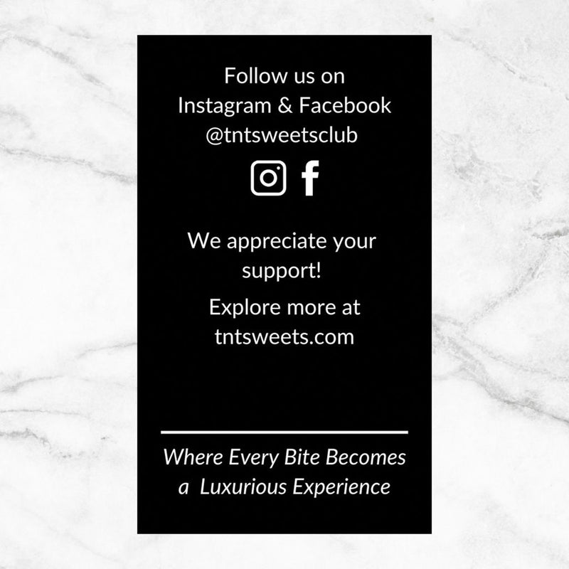 Reverse side of the TNT Sweets digital menu card featuring contact information and official Facebook and Instagram social media accounts, displayed on a white marble surface.
