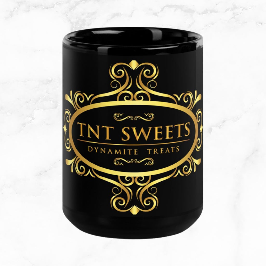 Black 15oz ceramic mug with a black logo on a white marble countertop.