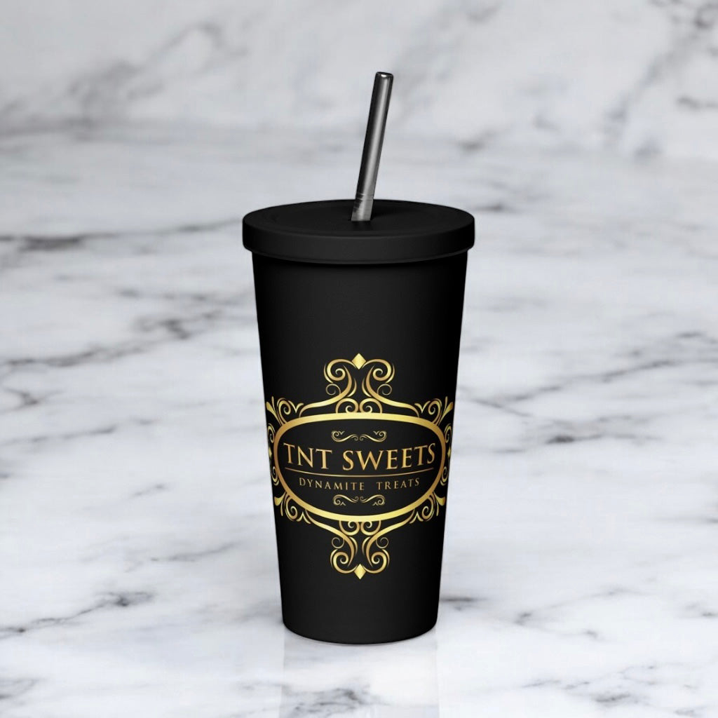 Signature black tumbler with gold logo on white marble countertop.