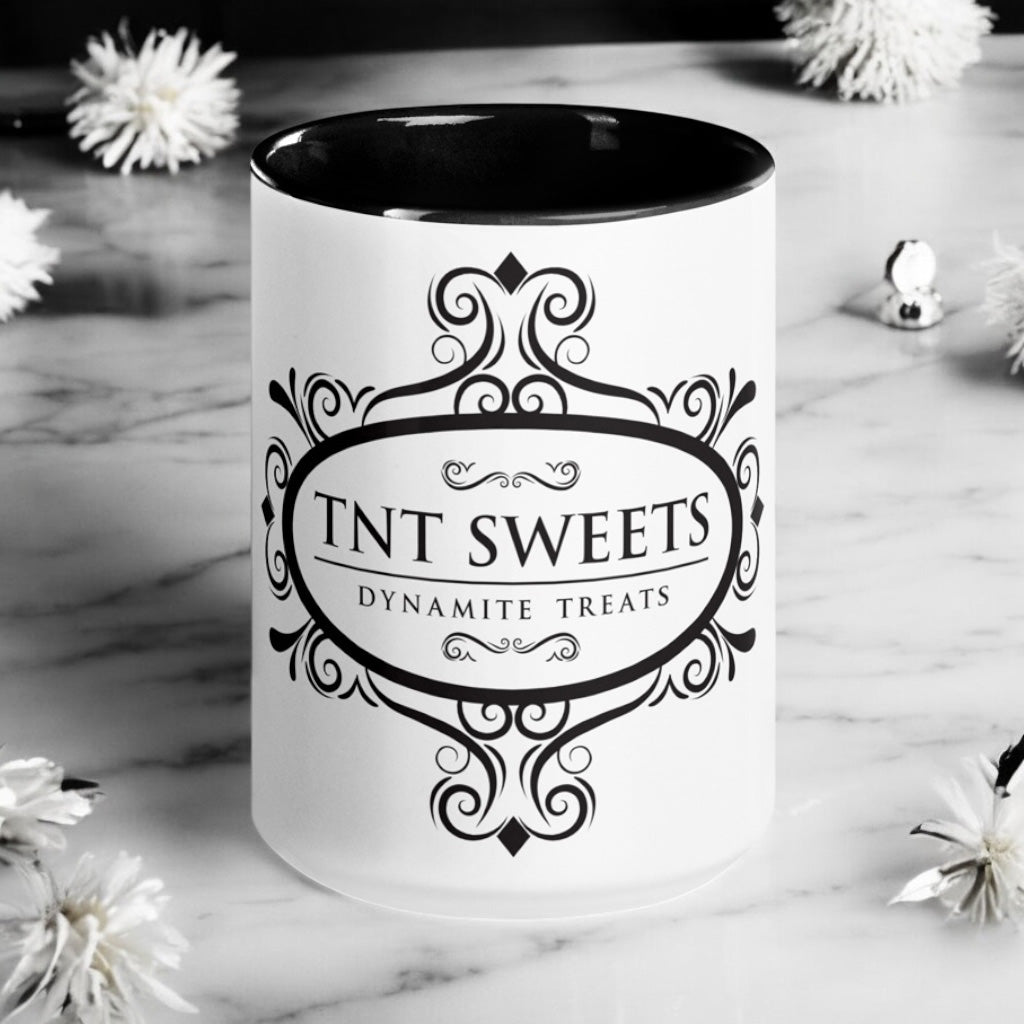 Classic white 15oz ceramic mug with black logo  on a marble countertop with spring decor.