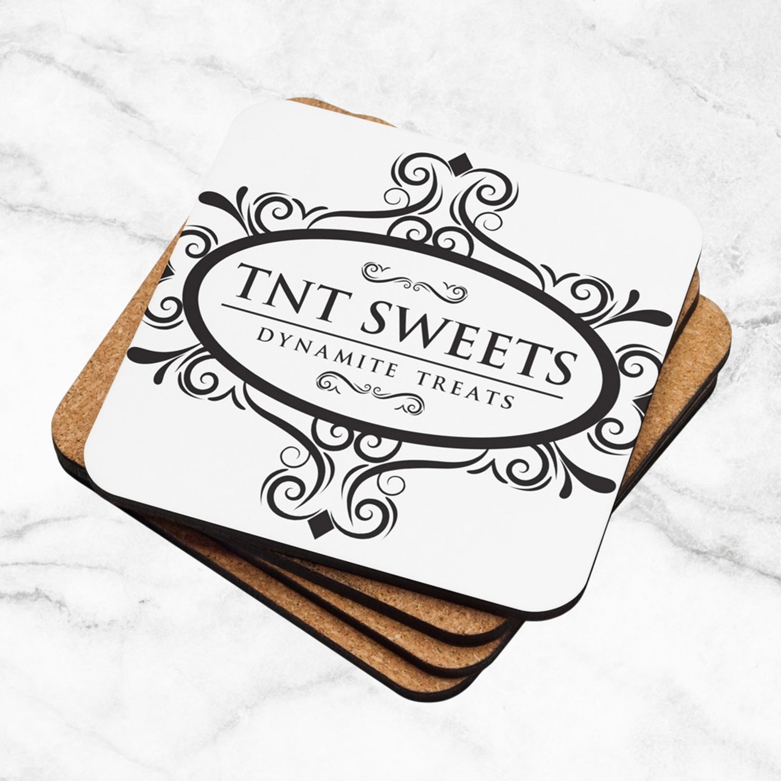 Stack of four white coasters with a black logo with a marble background.