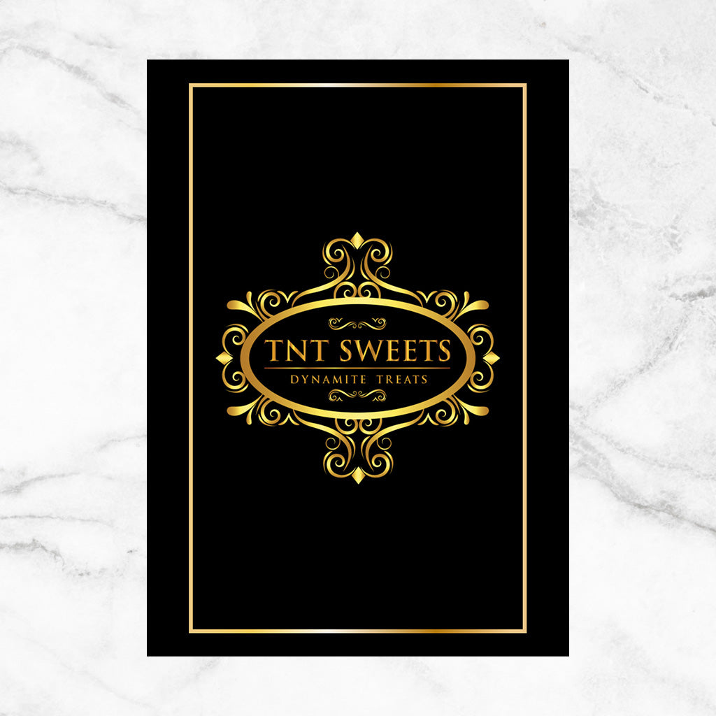 Backside of black cookie savoring guide insert on a white marble background. 