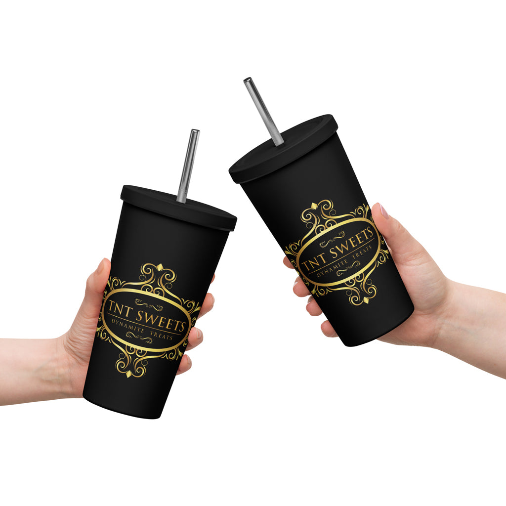 Holding two signature black tumblers with a gold logo on a white background.