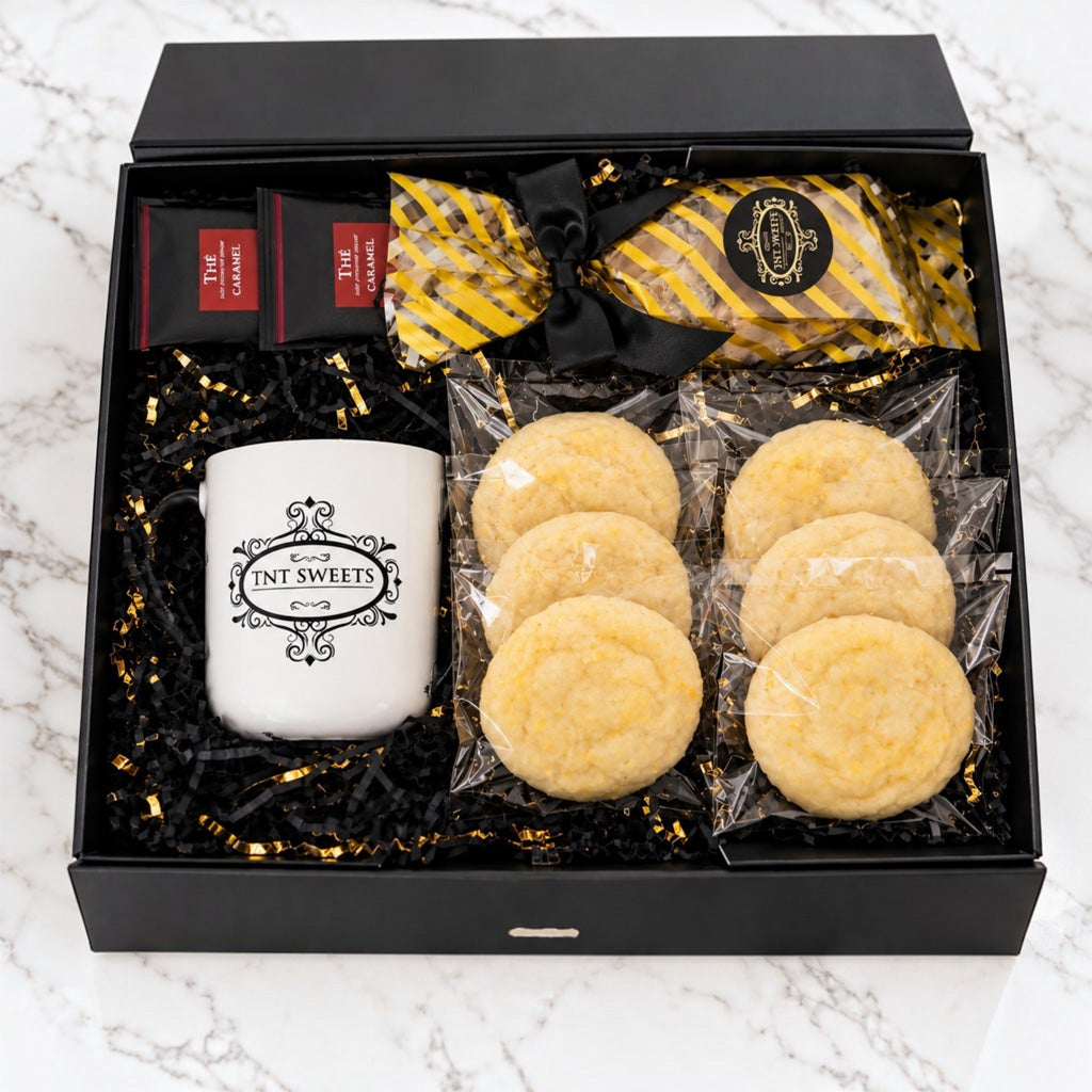 Black Tie Tower on dark marble, shown with its three keepsake boxes open: a dozen individually wrapped cookies, twist-wrapped caramels, and a bag of pecan halves in black-and-gold shred.