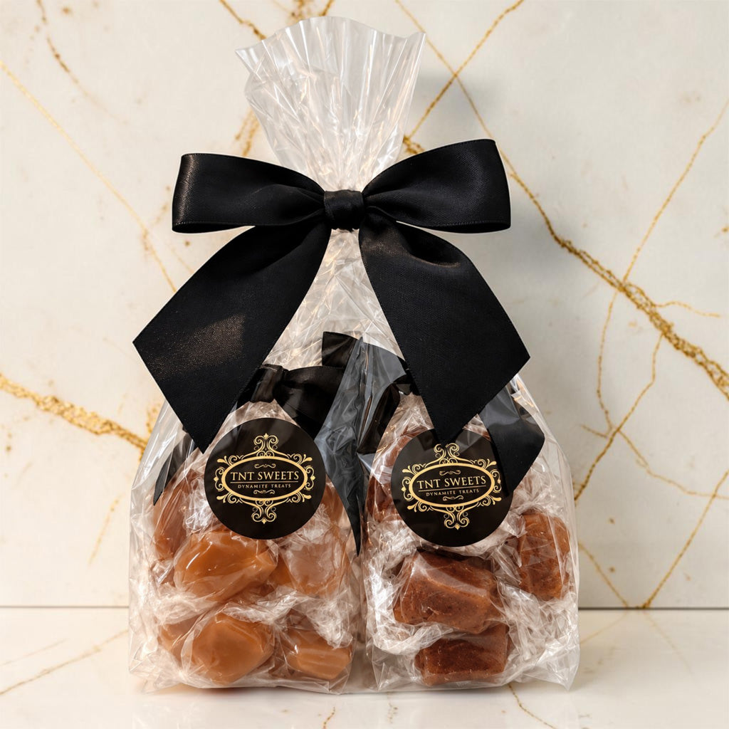 The Crescendo 15-piece caramel flight featuring Amber Velvet, Velvet Heat, Spiced Ambré, and Silk Roast in a gusset back ties with a black bow.