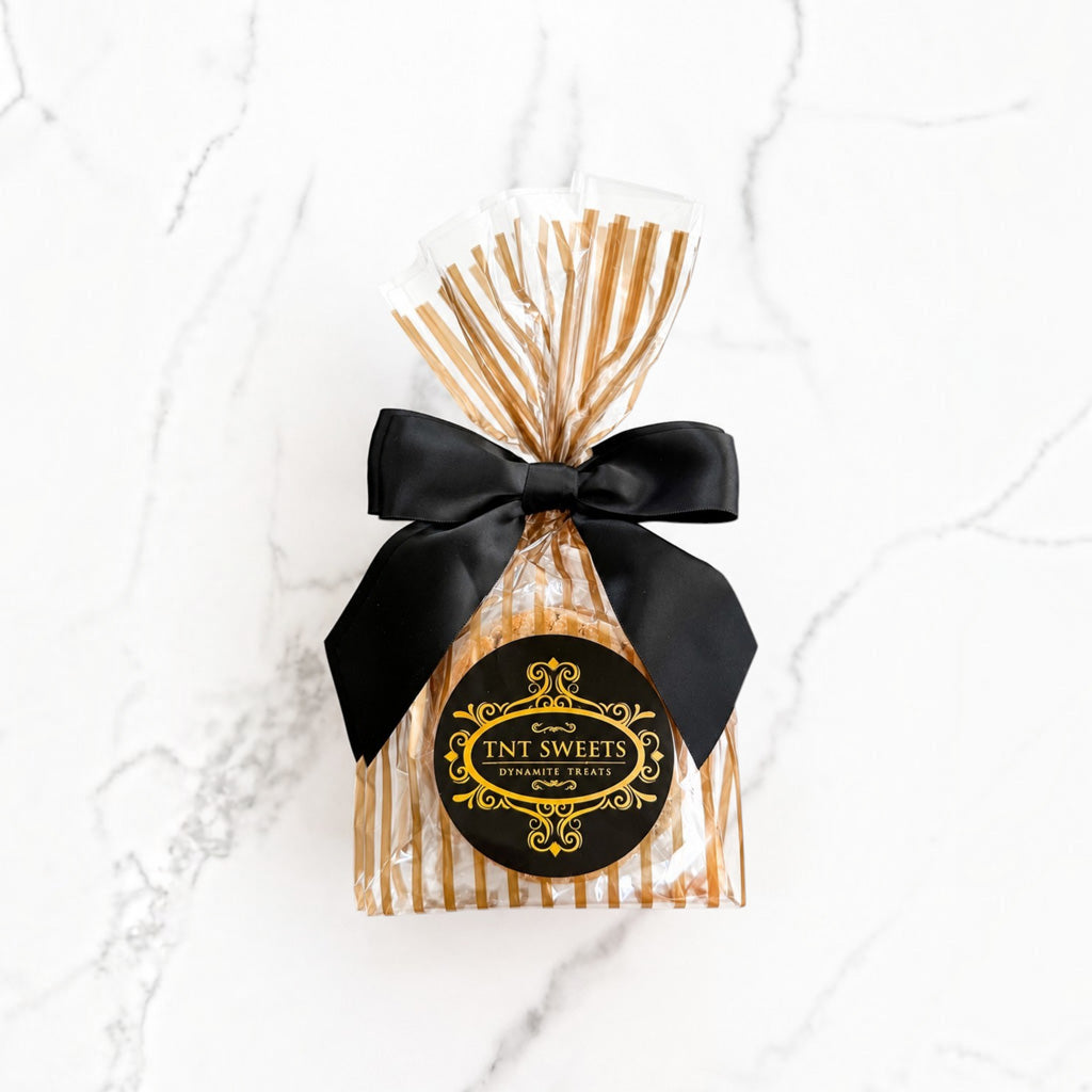TNT Sweets The Peanut Butter Reserve cookies 6-count Gold Stripe Wrap on a white marble background.