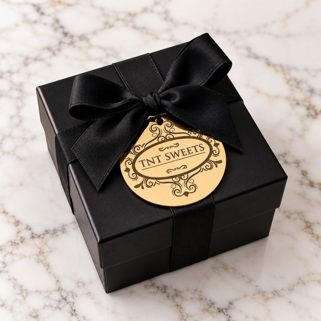 Small TNT Sweets keepsake box on a white marble background.