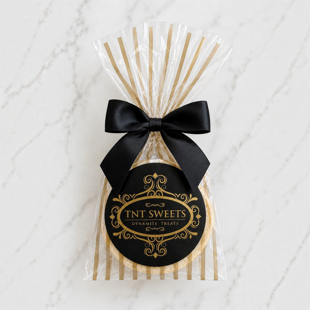 The Première vanilla bean shortbread cookie favor in TNT Sweets Gold Stripe Wrap.