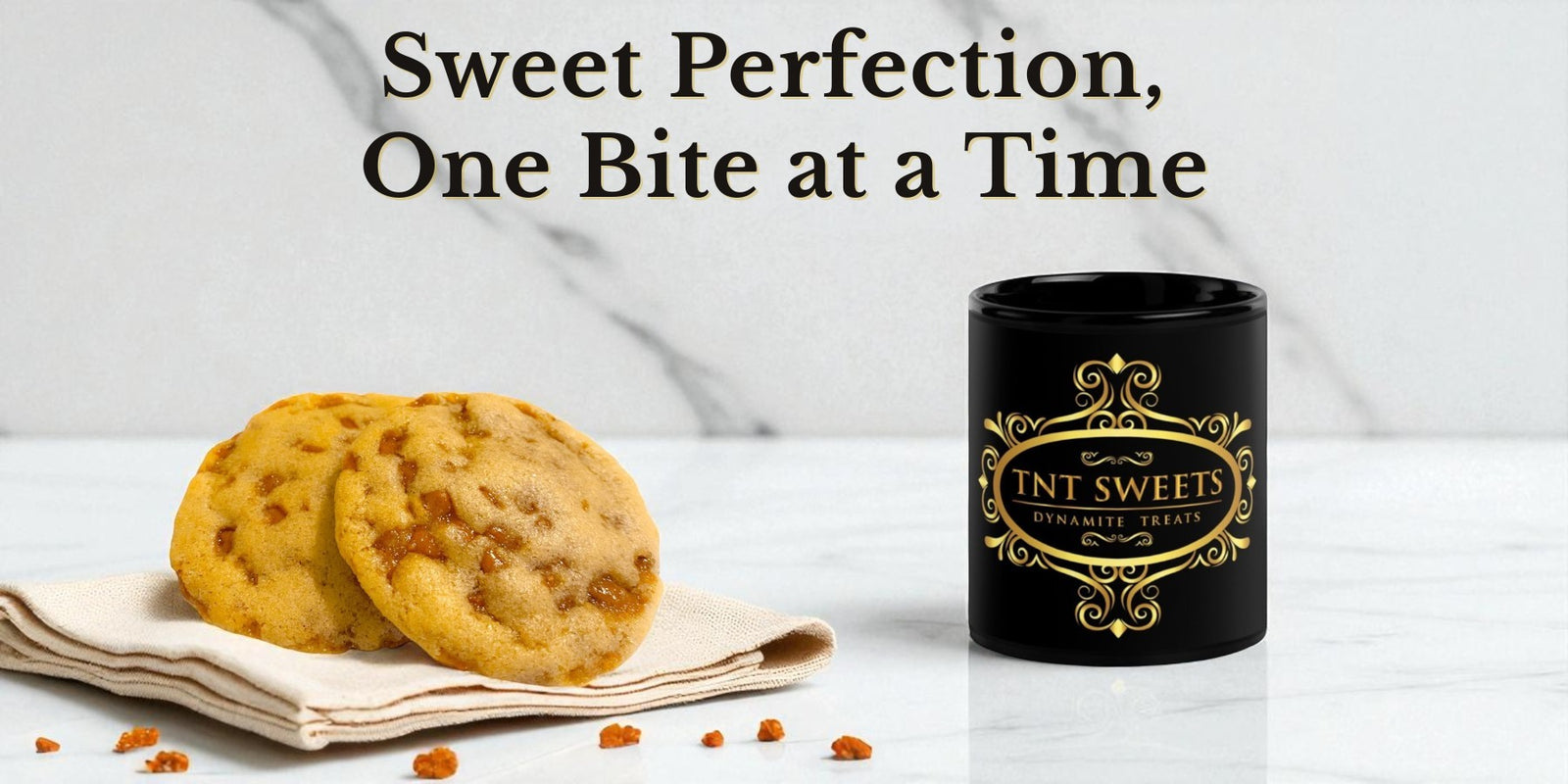 Toffee cookies on a linen napkin with scattered toffee bits, a black mug with gold logo on a white marble background.