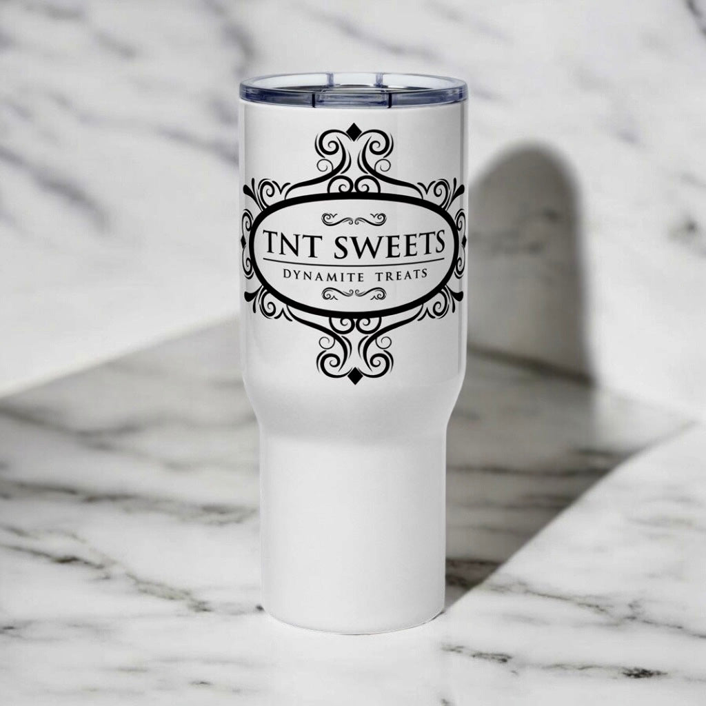 White Travel with mug with black TNT Sweets logo on a marble background.