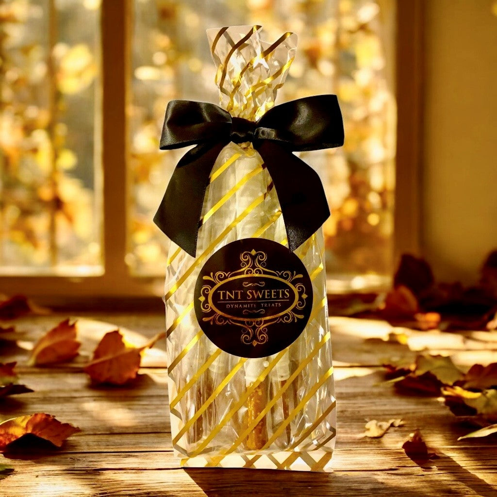 Stack of white chocolate pretzels with a fall scene background.