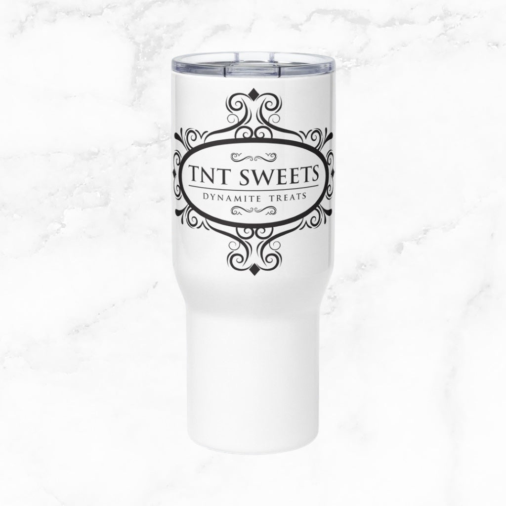 White Travel with mug with black TNT Sweets logo on a marble background.