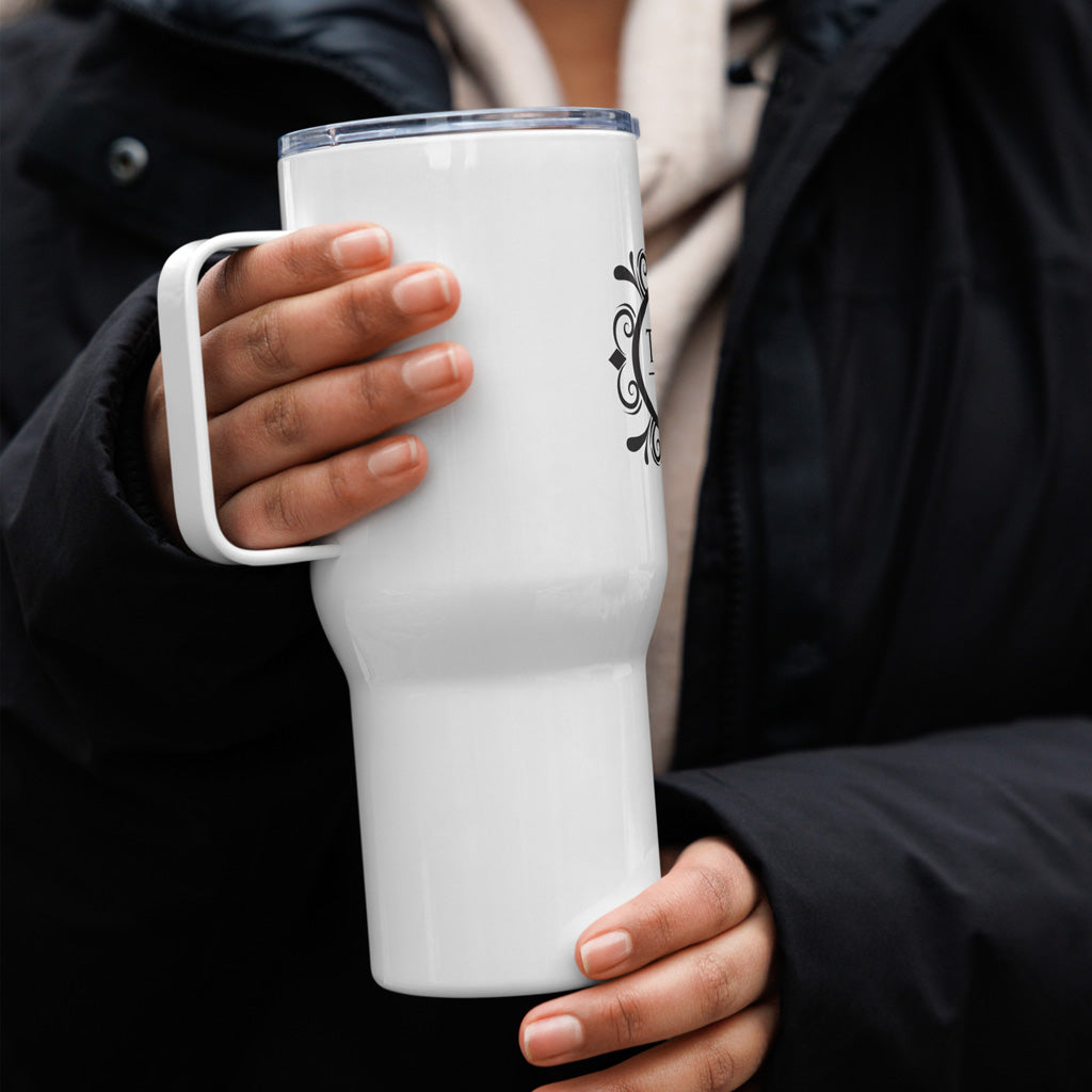 Person holding white 25oz travel mug.