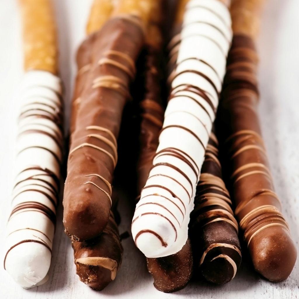 Stack of white chocolate, milk chocolate and dark chocolate pretzels with a blurred background.